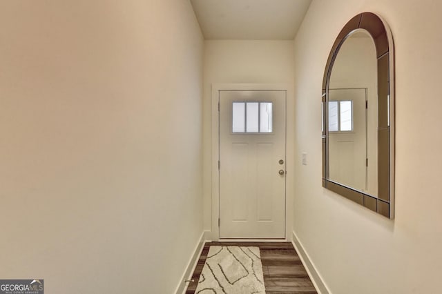 entryway with baseboards and dark wood finished floors
