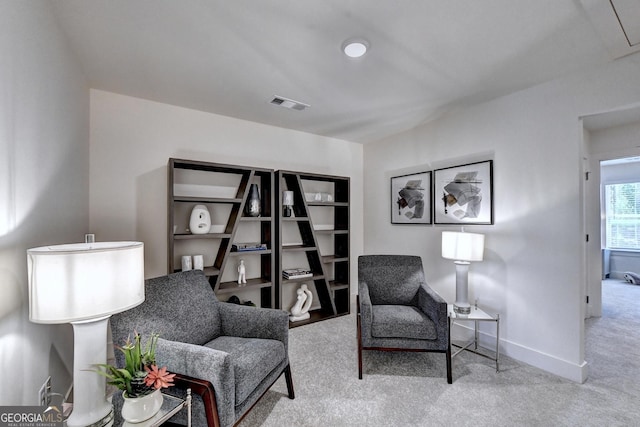 sitting room featuring carpet floors, baseboards, and visible vents