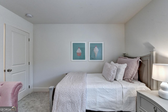 bedroom featuring light colored carpet