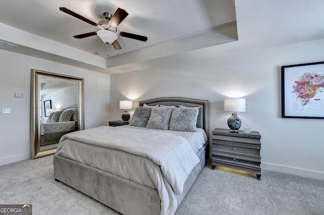 bedroom with baseboards, ceiling fan, light carpet, and visible vents