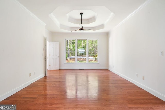 420 Martin Rd, Ellijay, GA 30536 - unfurnished room featuring ceiling fan, crown molding, wood finished floors, a raised ceiling, and baseboards