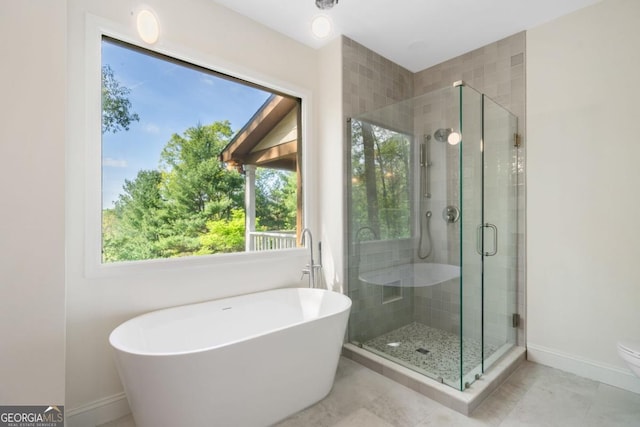 420 Martin Rd, Ellijay, GA 30536 - full bathroom with baseboards, a soaking tub, and a shower stall