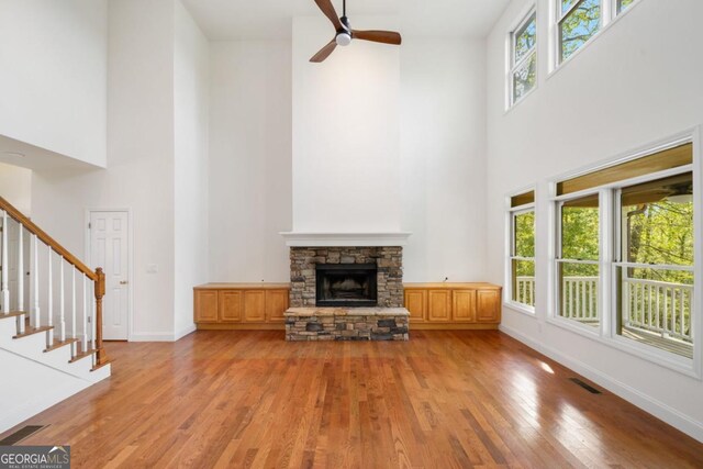 420 Martin Rd, Ellijay, GA 30536 - unfurnished living room featuring light wood finished floors, a high ceiling, and a wealth of natural light