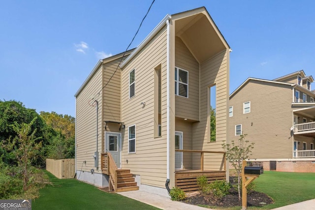 585 Ira St SW, Atlanta, GA 30312 - rear view of property featuring a lawn