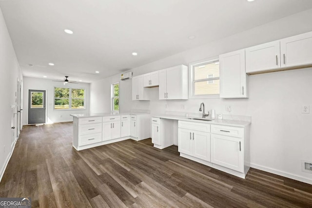 585 Ira St SW, Atlanta, GA 30312 - kitchen featuring a sink, baseboards, and dark wood-type flooring