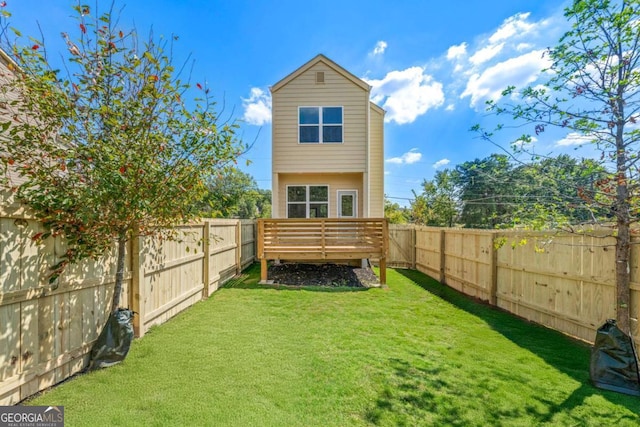 585 Ira St SW, Atlanta, GA 30312 - back of property with a fenced backyard, a yard, and a deck