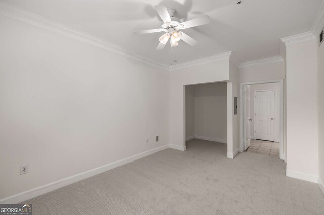3777 Peachtree Rd Unit 1536, Atlanta, GA 30319 - unfurnished bedroom featuring a ceiling fan, baseboards, light colored carpet, and ornamental molding