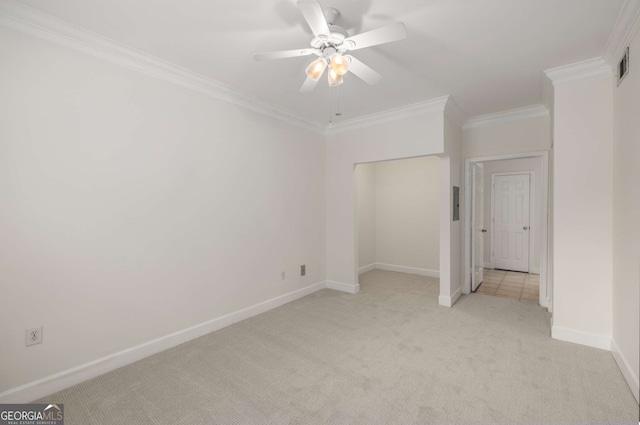 3777 Peachtree Rd Unit 1536, Atlanta, GA 30319 - unfurnished bedroom with a ceiling fan, visible vents, crown molding, light colored carpet, and baseboards