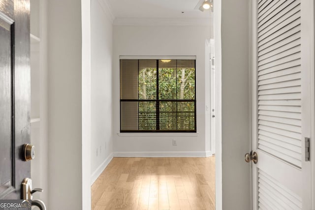 3777 Peachtree Rd Unit 1536, Atlanta, GA 30319 - hallway with baseboards, ornamental molding, and light wood-style flooring