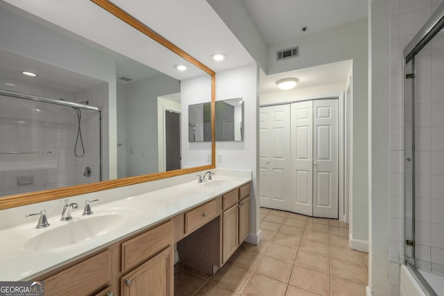3777 Peachtree Rd Unit 1536, Atlanta, GA 30319 - bathroom with a sink, tile patterned floors, tiled shower, and visible vents