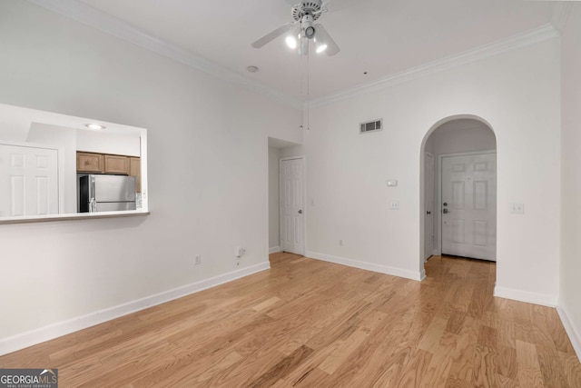 3777 Peachtree Rd Unit 1536, Atlanta, GA 30319 - unfurnished room with ceiling fan, visible vents, arched walkways, baseboards, and ornamental molding