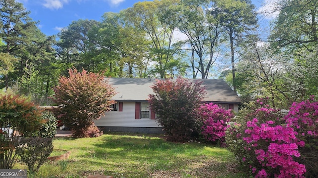 402 Emmett St, Riverdale, GA 30274 - view of property exterior with a lawn and crawl space