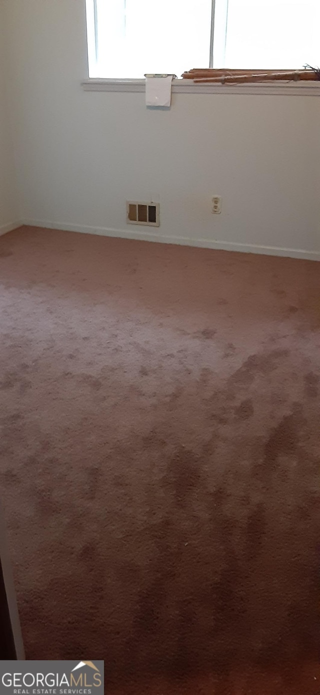 402 Emmett St, Riverdale, GA 30274 - carpeted spare room featuring baseboards and visible vents