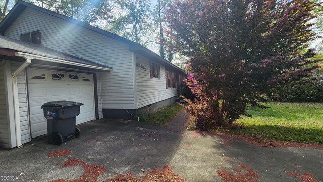 402 Emmett St, Riverdale, GA 30274 - view of home's exterior with an attached garage and driveway