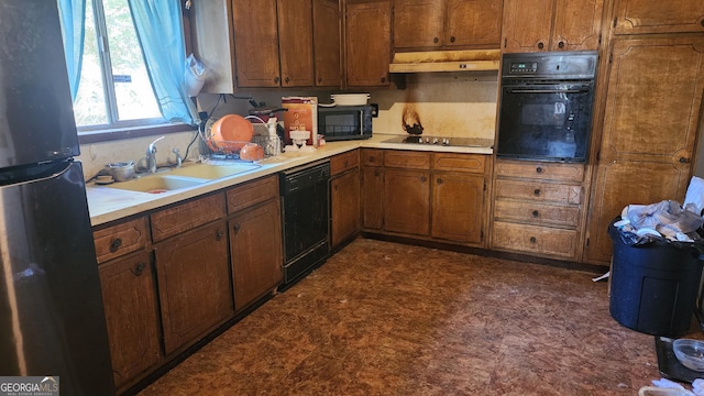 402 Emmett St, Riverdale, GA 30274 - kitchen featuring a sink, black appliances, dark floors, and light countertops