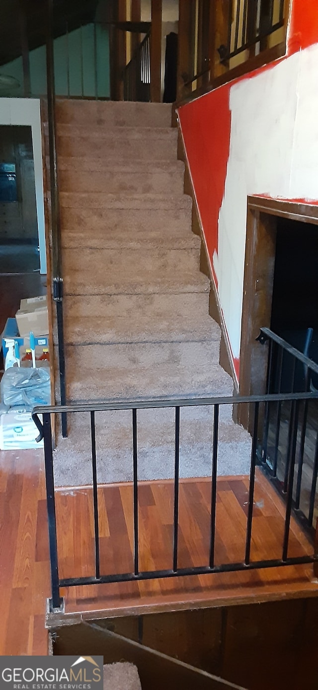 402 Emmett St, Riverdale, GA 30274 - staircase featuring wood finished floors