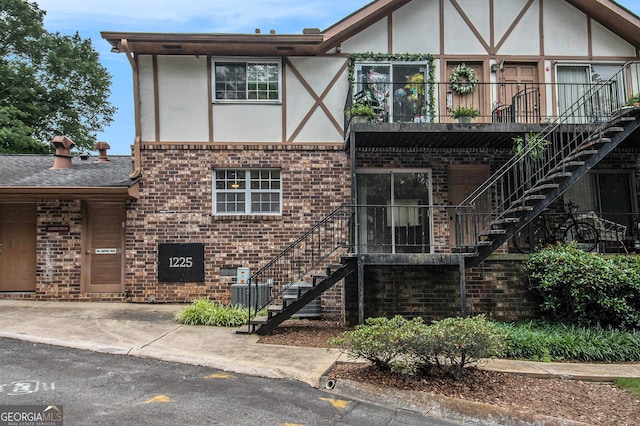 1225 Church St Unit A, Decatur, GA 30030 - view of front of property featuring stairway, brick siding, and stucco siding