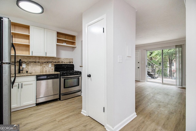 1225 Church St Unit A, Decatur, GA 30030 - kitchen with stainless steel appliances, open shelves, white cabinets, and light wood-style floors