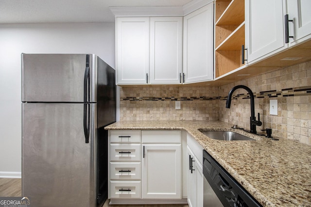 1225 Church St Unit A, Decatur, GA 30030 - kitchen with appliances with stainless steel finishes, backsplash, white cabinetry, light stone countertops, and open shelves