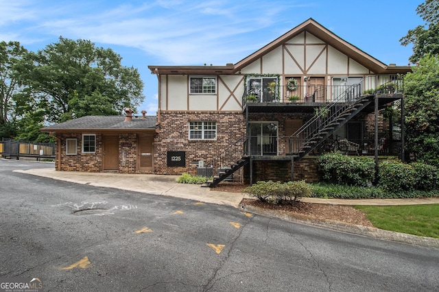 1225 Church St Unit A, Decatur, GA 30030 - tudor-style house with stairway, stucco siding, brick siding, and a deck