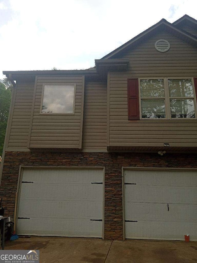 143 Delane Dr, Dallas, GA 30157 - view of side of home with a garage