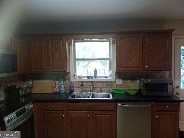 143 Delane Dr, Dallas, GA 30157 - kitchen with a sink, tasteful backsplash, stainless steel appliances, and a wealth of natural light