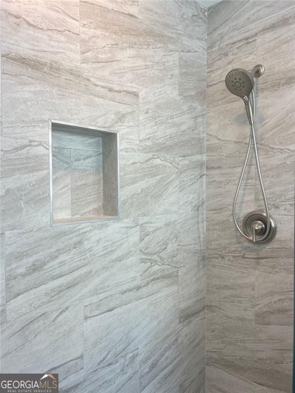 bathroom view of tiled shower