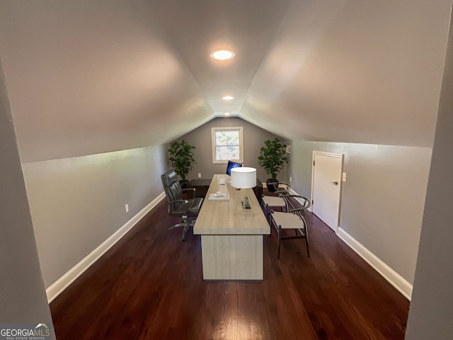 home office featuring vaulted ceiling, baseboards, and dark wood-type flooring