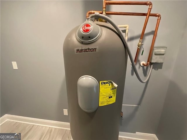utility room with electric water heater