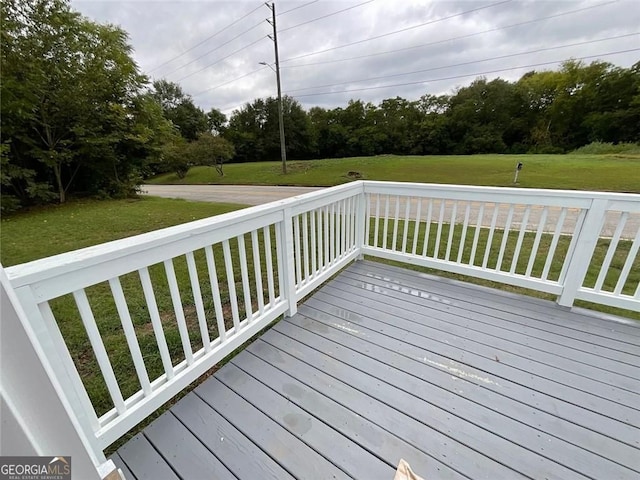 deck featuring a lawn