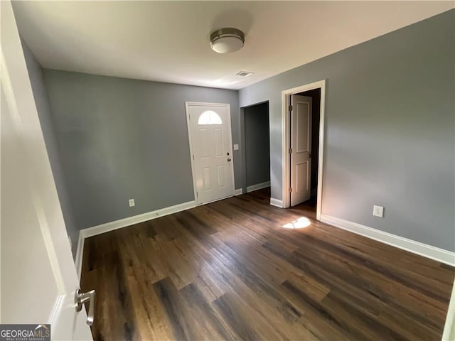entryway with baseboards and dark wood finished floors