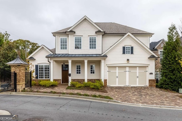 view of road with a gate, a gated entry, curbs, and a residential view