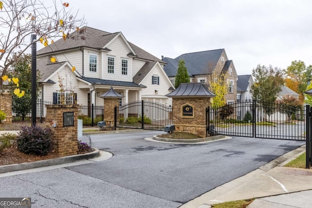 drone / aerial view with a residential view and a wooded view