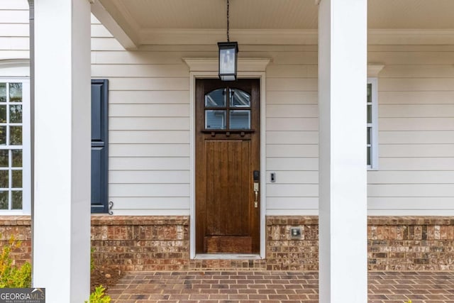 entrance to property with covered porch