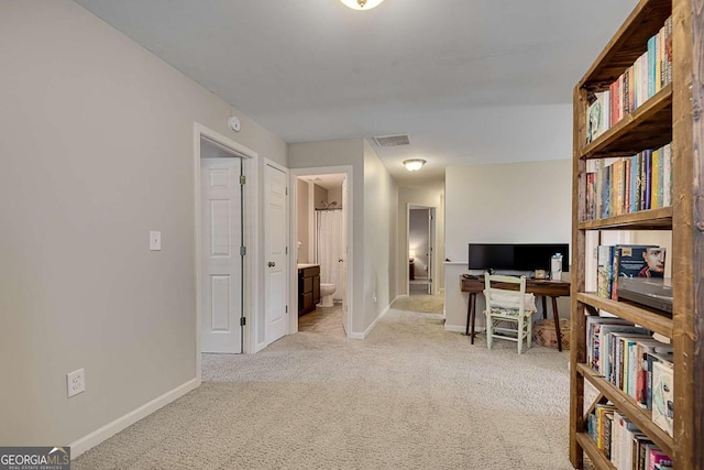 office area featuring visible vents, carpet, and baseboards