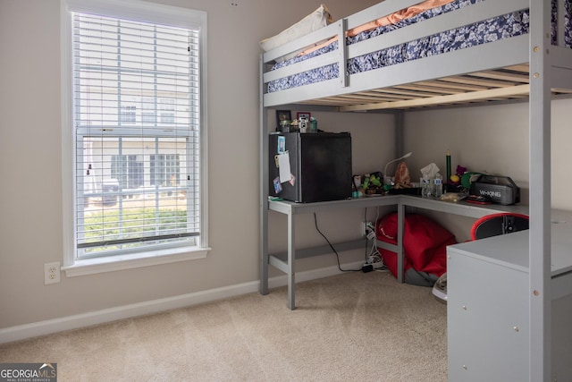 1306 Thornborough Dr Unit 1306, Alpharetta, GA 30004 - carpeted bedroom featuring multiple windows, baseboards, and freestanding refrigerator