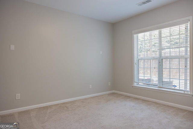 1306 Thornborough Dr Unit 1306, Alpharetta, GA 30004 - spare room featuring light carpet and baseboards