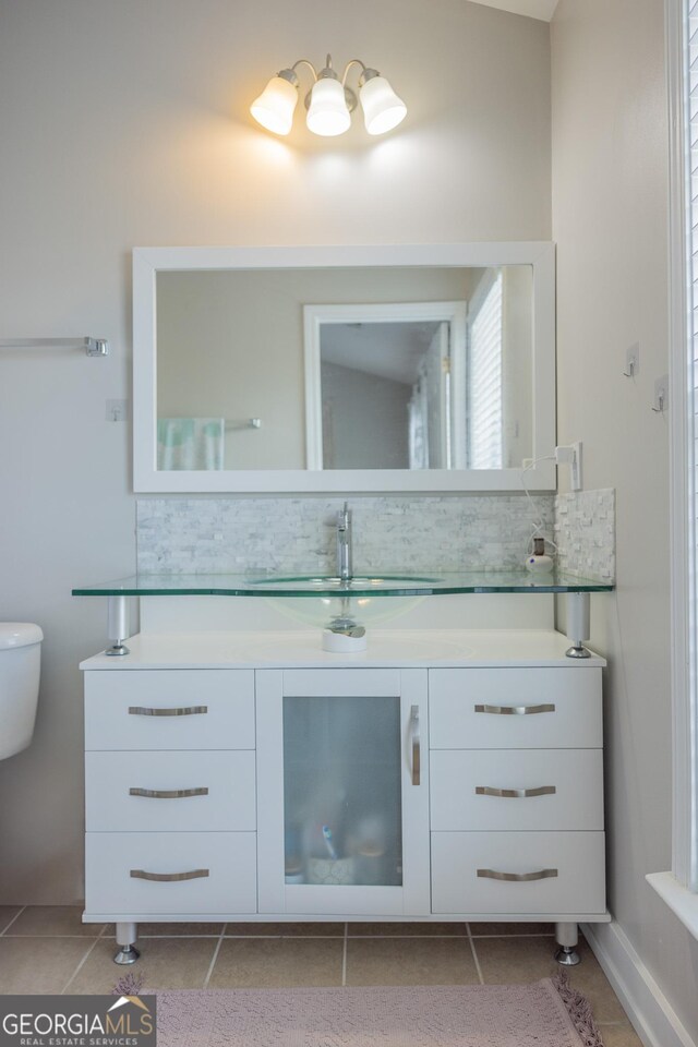 1306 Thornborough Dr Unit 1306, Alpharetta, GA 30004 - bathroom featuring tile patterned flooring, vanity, tasteful backsplash, and toilet