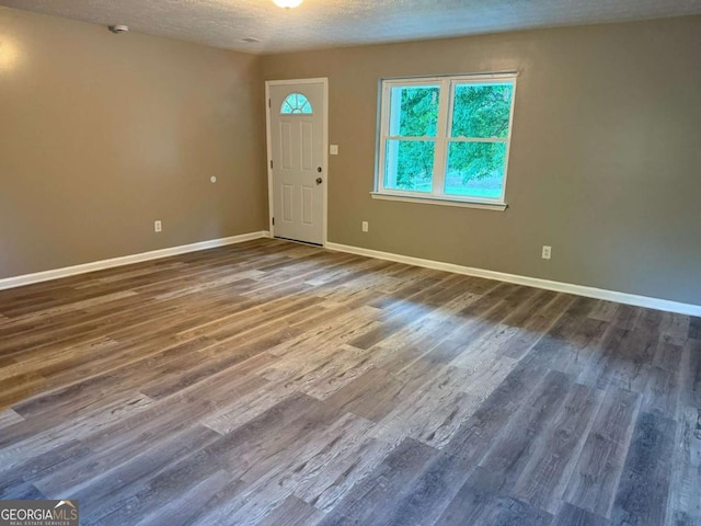 184 Quail Rd, Griffin, GA 30223 - entryway with a textured ceiling, baseboards, and wood finished floors
