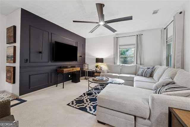 1149 Midland NW, Acworth, GA 30102 - living room featuring a ceiling fan and light colored carpet