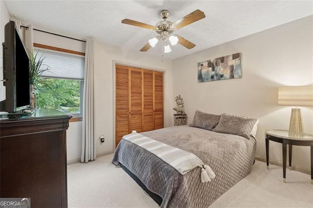 1149 Midland NW, Acworth, GA 30102 - bedroom with light carpet, a closet, and ceiling fan