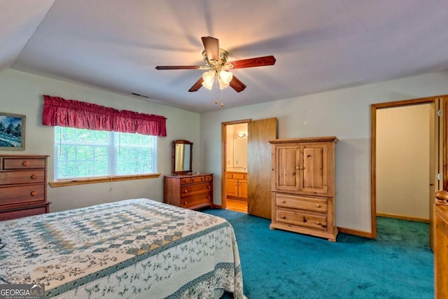 bedroom featuring baseboards, a ceiling fan, dark carpet, and connected bathroom