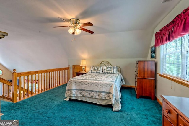 carpeted bedroom featuring ceiling fan and vaulted ceiling