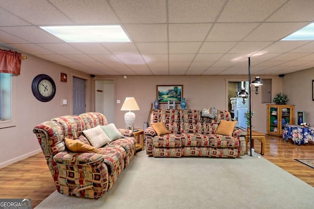 living room featuring baseboards and wood finished floors