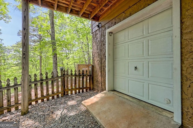 garage featuring fence