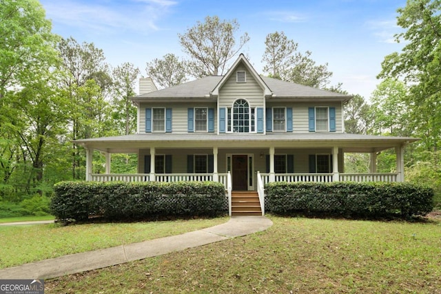 569 Hale Mountain Ct, Hiram, GA 30141 - view of front of home with a chimney, a porch, and a front lawn