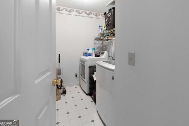 569 Hale Mountain Ct, Hiram, GA 30141 - clothes washing area featuring laundry area, light tile patterned floors, and separate washer and dryer