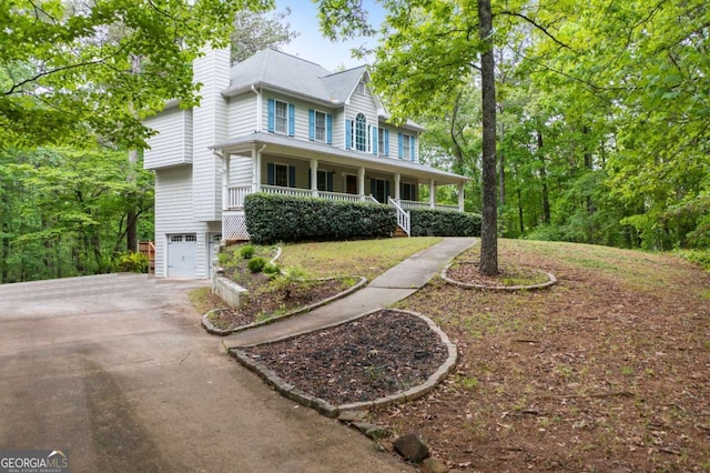 569 Hale Mountain Ct, Hiram, GA 30141 - colonial inspired home with a porch, an attached garage, driveway, and a chimney