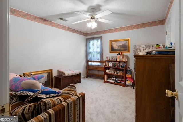 569 Hale Mountain Ct, Hiram, GA 30141 - carpeted bedroom with a ceiling fan, a textured ceiling, and visible vents