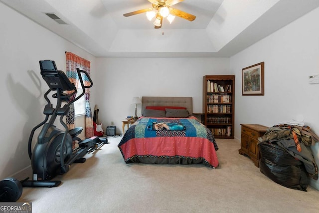 569 Hale Mountain Ct, Hiram, GA 30141 - bedroom featuring visible vents, carpet flooring, a ceiling fan, and a tray ceiling